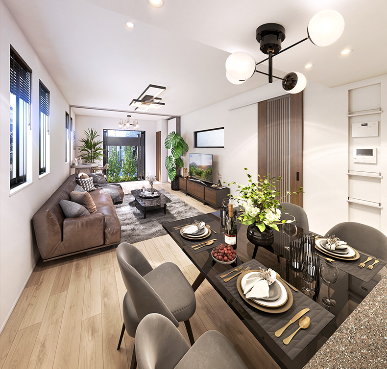 ダイニングからリビングとその先のバルコニーの緑を眺めている画像。窓から陽射しが差し込んでいます。